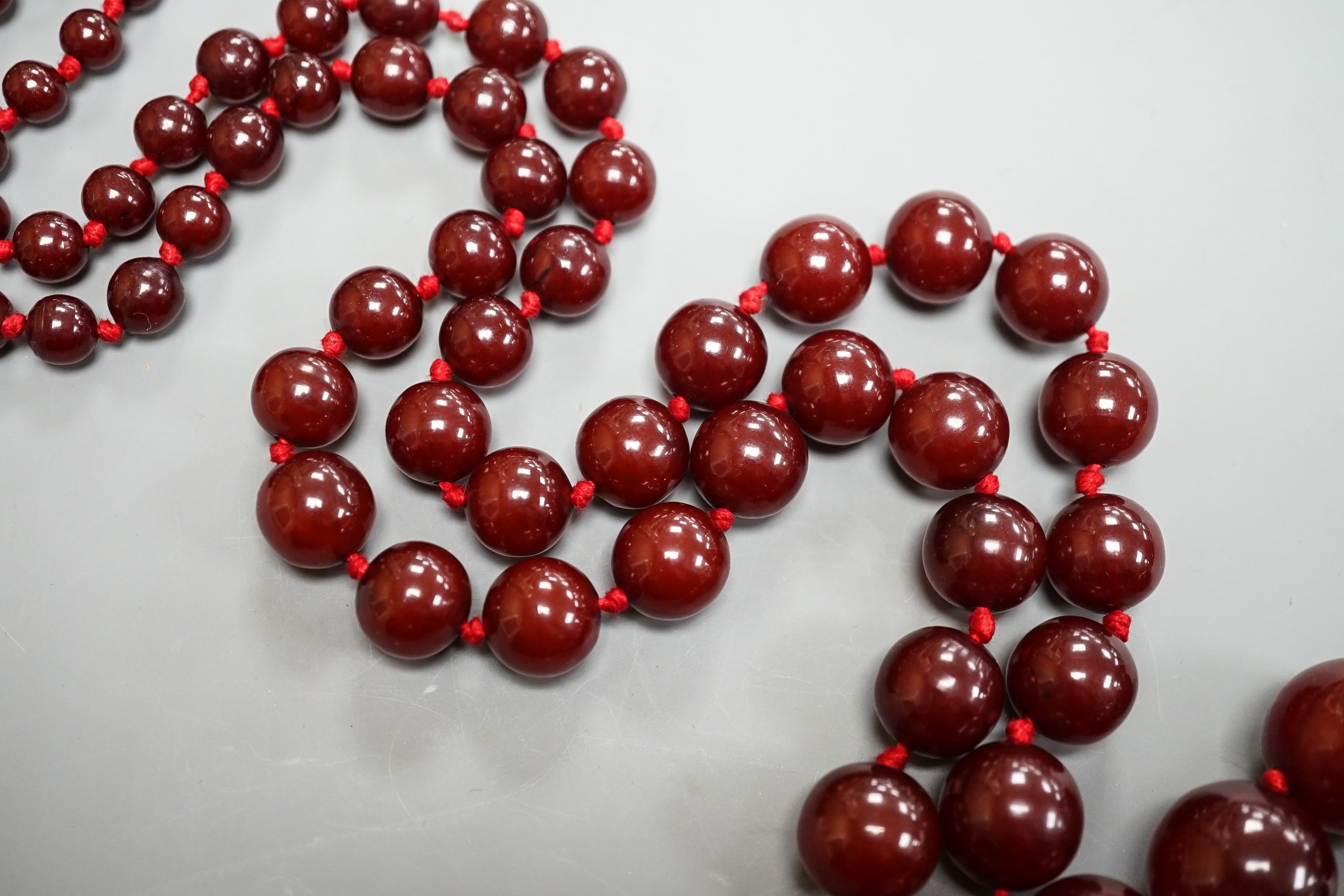 A graduated cherry amber bead necklace, 110cm, gross weight 94 grams.